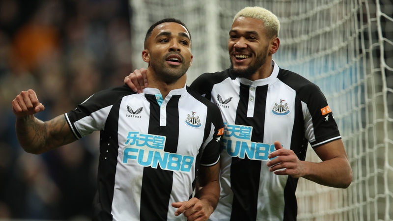 Callum Wilson (L) celebrates his goal for Newcastle with Jolinton