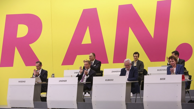 FDP delegates applaud after the party voted in favor of the coalition