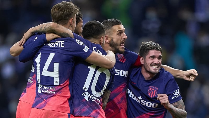 Atletico players celebrate their progress