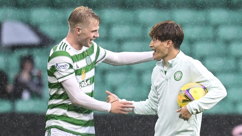 Celtic's Stephen Welsh (L) and Kyogo Furuhashi