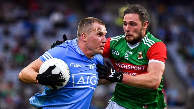Pádraig O'Hora keeps tabs on Dublin's Ciarán Kilkenny during the 2021 All-Ireland semi-final