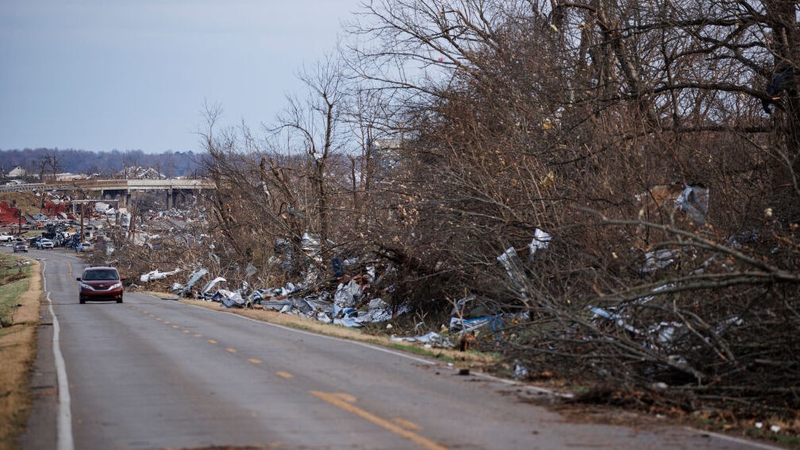 Debris litters Fulton Road following a powerful tornado that left a path of destruction today in Mayfield, Kentucky