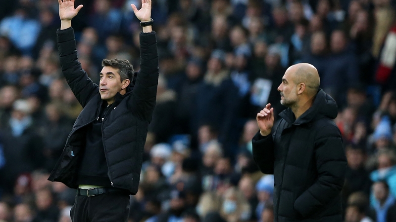 Wolves boss Bruno Lage (L) and City manager Pep Guardiola on the sideline