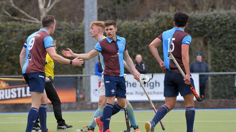 Three Rock Rovers players Andy Keane, centre, celebrates his goal with Ross Canning and Matteo Romoli