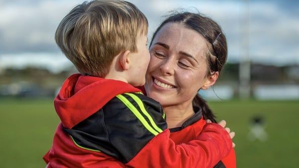 Oulart the Ballagh's Mary Leacy celebrates post-match with her son Jake