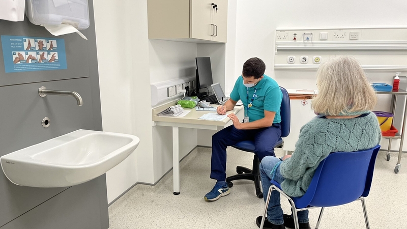 A woman gets her booster jab at the Ulster Hospital outside Belfast