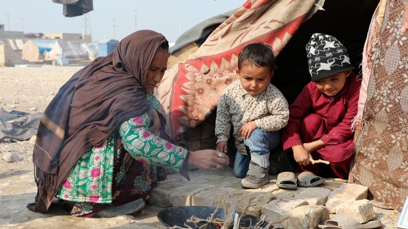 Internally displaced Afghans are seen in a camp in Balkh, Afghanistan