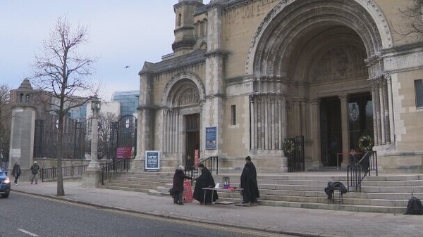 The annual 'Black Santa' sit out by the Dean of St Anne's Cathedral collects several hundred thousand pounds a year