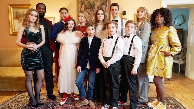 Who's for a few mince pies? The cast of Silent Night gather for the Christmas. Photo: AMC+ / RLJE Films