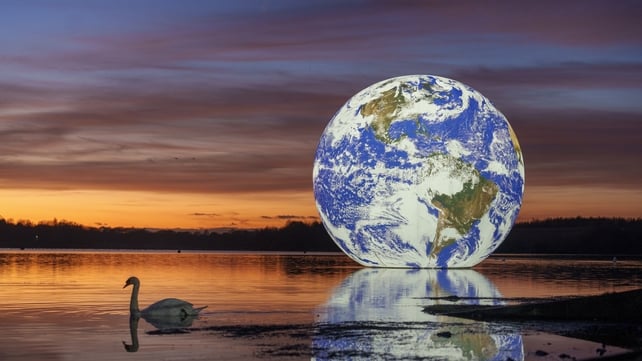 22 November: The sun sets behind artist Luke Jerram's 'Floating Earth' at Pennington Flash in Wigan, England (Photo: Christopher Furlong)