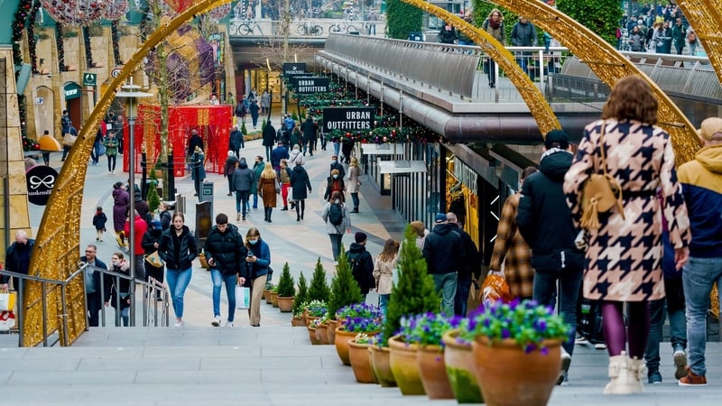 Shoppers walk in the centre of Rotterdam in the Netherlands today