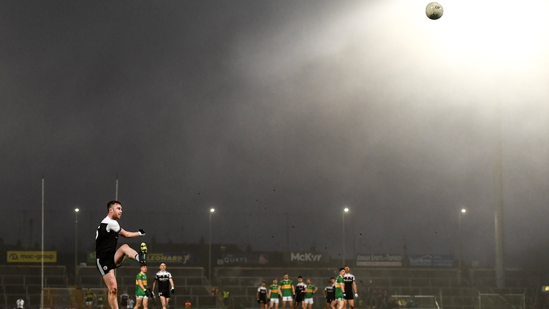 Paul Devlin slots over a free for Kilcoo