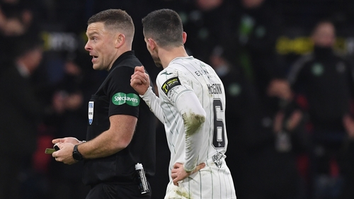 Paul McGinn (R) confronts referee John Beaton after Kyogo Furuhashi's second goal.
