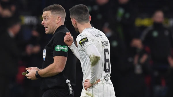 Paul McGinn (R) confronts referee John Beaton after Kyogo Furuhashi's second goal.