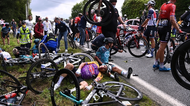 26 June: A spectator holding a sign at the 1st stage of the 108th edition of the Tour de France race was responsible for a huge crash. The woman had to pay a €1,200 fine (Photo: Anne-Christine Poujoulat)