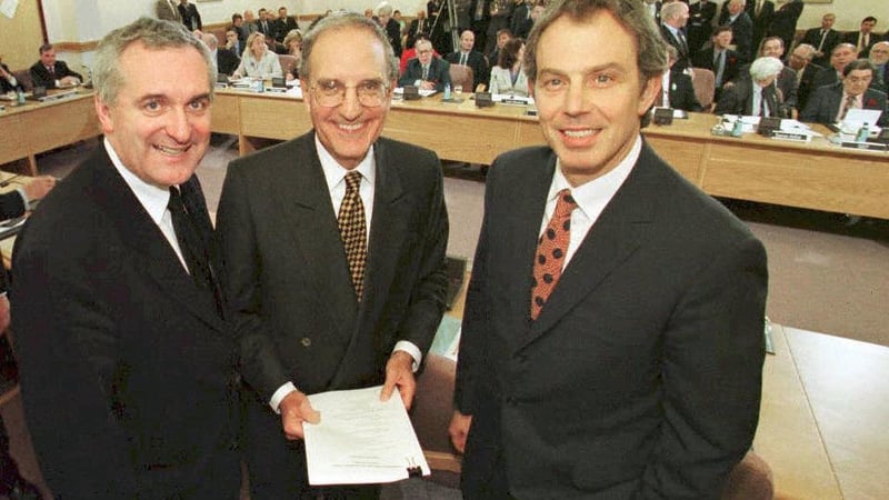 The deal is done: British prime Minister Tony Blair, US senator George Mitchell and Taoiseach Bertie Ahern on April 10th, 1998, after they signed an historic agreement for peace in Northern Ireland. Photo: Dan Chung/Pool/AFP via Getty Images