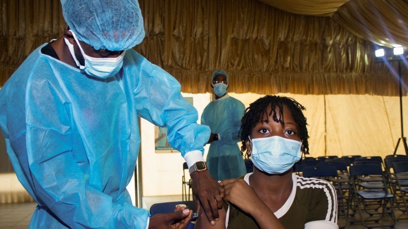 A nurse administers a Covid-19 vaccine in Angola; just 8.6% of people in Africa have been fully vaccinated