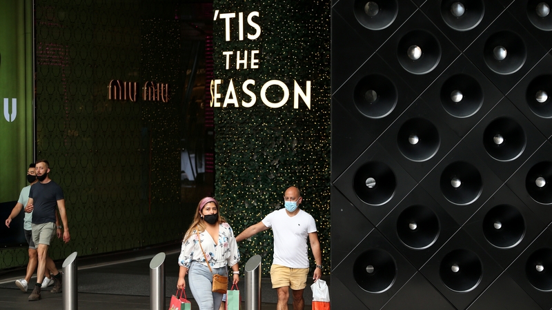 Shoppers are seen at a shopping centre in Sydney, Australia on Christmas Eve