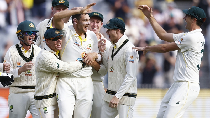 Scott Boland is congratulated by team-mates after one of his six wickets for just seven runs