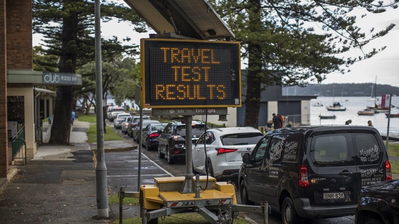 People queue in cars at a testing centre in Sydney
