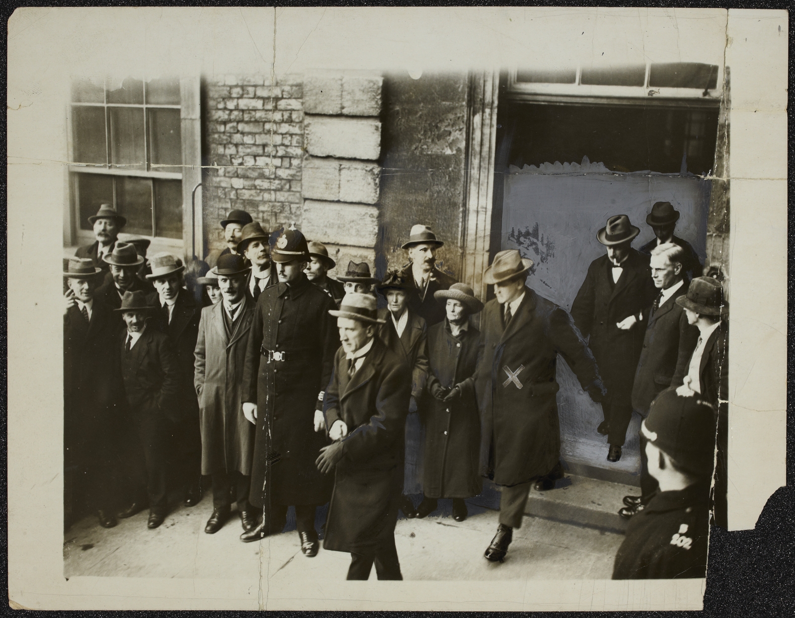 Michael Collins leaving the Castle with Kevin O'Higgins and W. T. Cosgrave after the "surrender" ceremony. Image courtesy of the National Library of Ireland