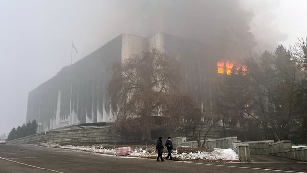 An outside view of the burning mayor's office which was set on fire during unrest in Almaty, Kazakhstan (GETTY)