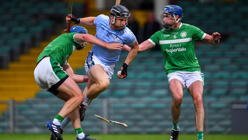 Kilmallock's Mark O'Loughlin (L) and Gavin O'Mahony try to stop Kevin Downes in a 2020 Limerick SHC clash