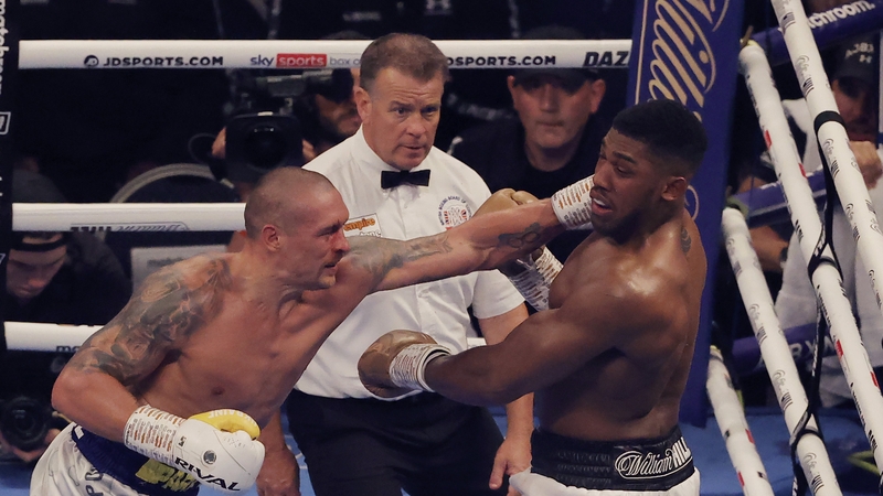 Oleksandr Usyk hits Anthony Joshua during their world title 
fight last September.