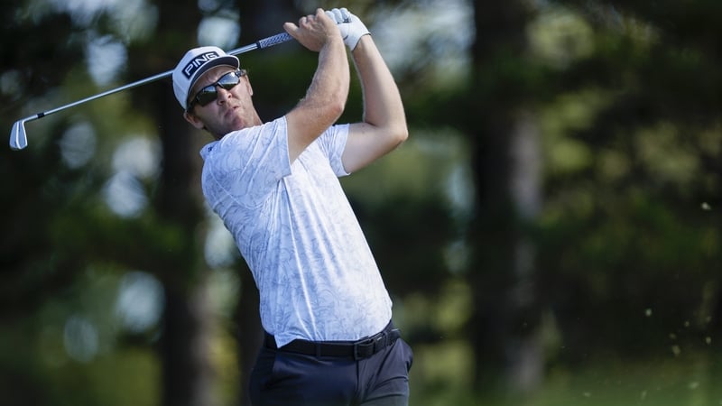 Power plays his shot from the second tee during Friday's round