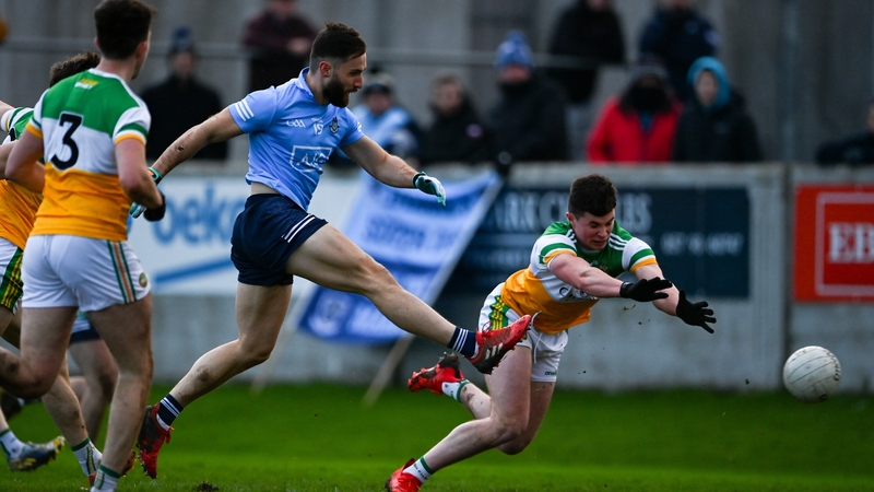 Warren Egan scores late on for Dublin despite the tackle of Kieran Dolan