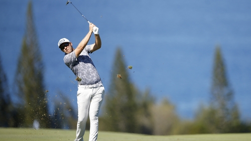 Power plays a second shot on the fourth hole during the third round