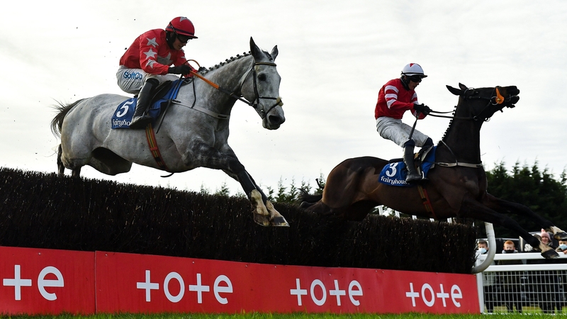 Dunvegan, left, with Bryan Cooper up, jumps the last on their way to winning
