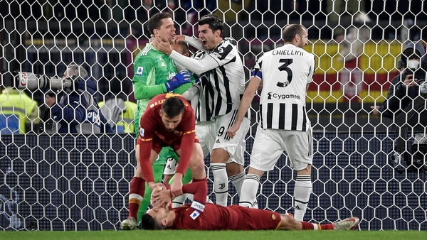 Alvaro Morata and Giorgio Chiellini celebrate with Wojciech Szczesny after he saved penalty
