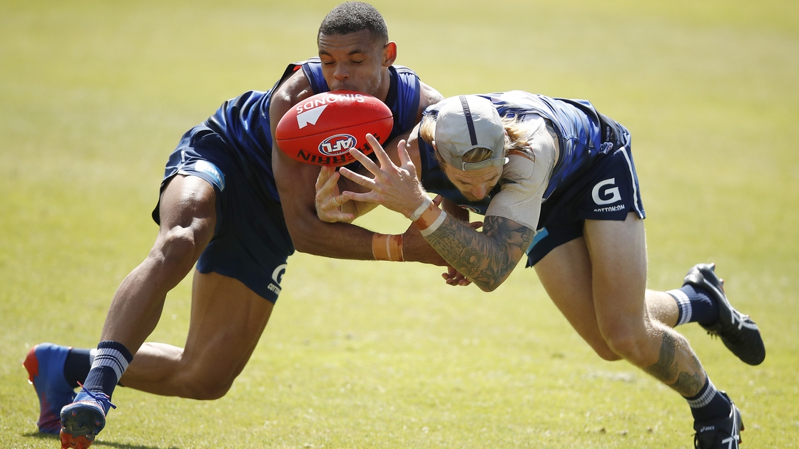 Battling for possession with Tom Stewart during training last year