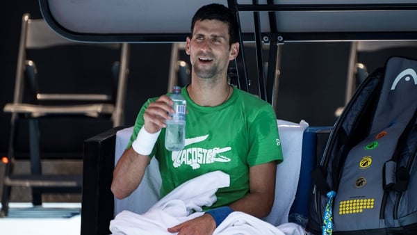 Novak Djokovic takes a break during practice on Thursday