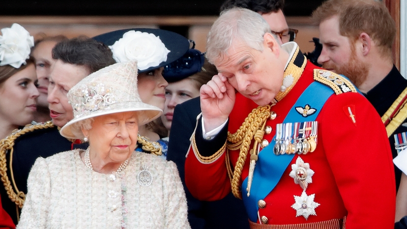 Britain's Queen Elizabeth and Prince Andrew watch a flypast from the balcony of Buckingham Palace in 2019