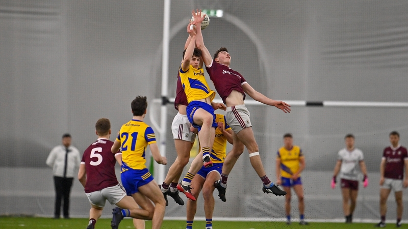 Players from both sides contest a high ball