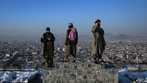 Members of the Taliban stand over a plinth overlooking Kabul (File image)