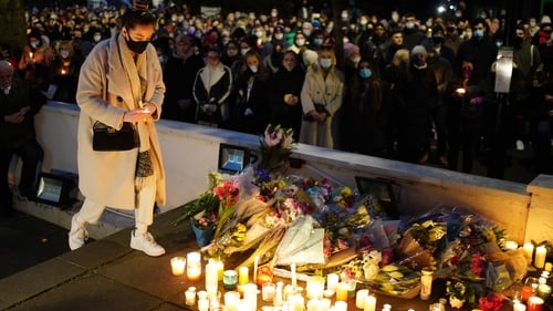 Floral tributes and candles are left outside the London Irish Centre in memory of Ashling Murphy
