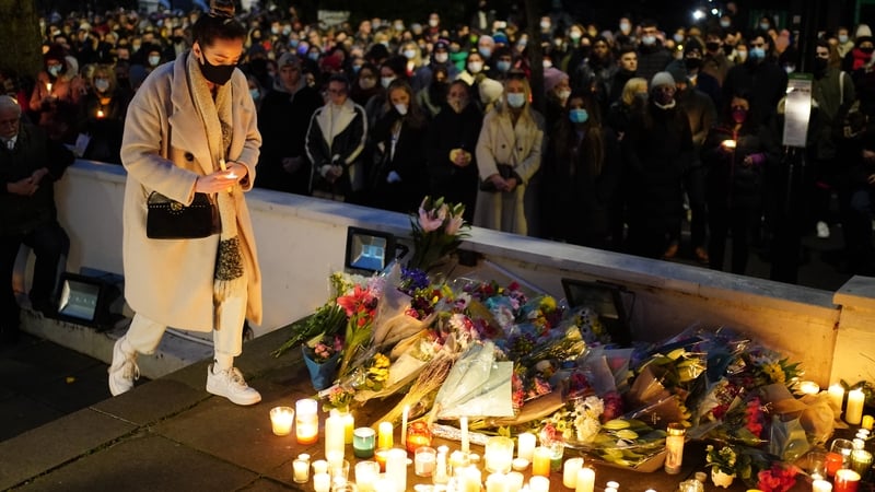 Floral tributes and candles are left outside the London Irish Centre in memory of Ashling Murphy