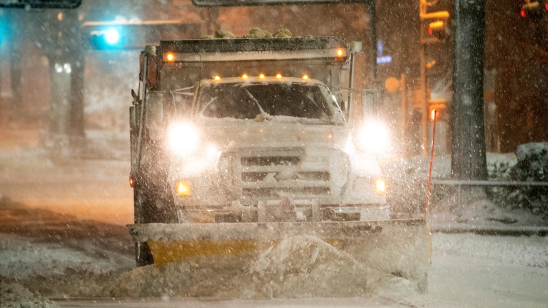 A truck clears Main St in Greenville, South Carolina. More than 80 million people fell under the winter weather alerts