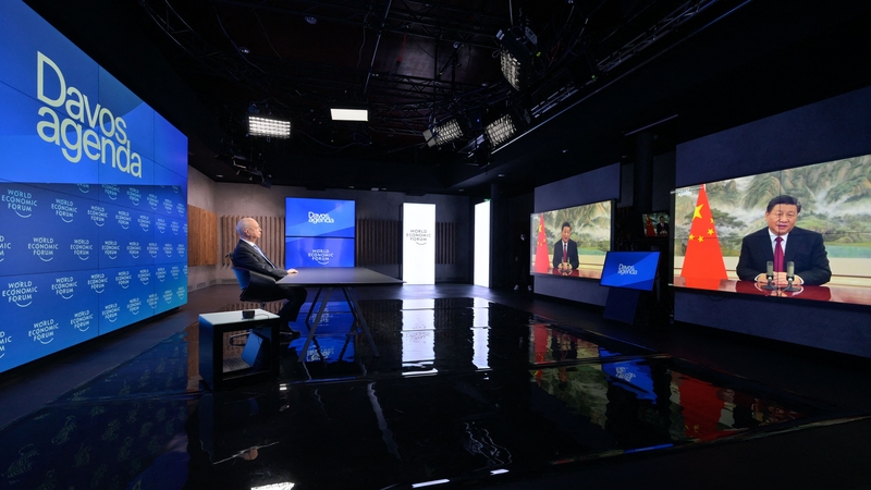 Founder and executive chairman of the World Economic Forum Klaus Schwab listens to Chinese President Xi Jinping virtual speech