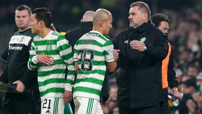 Yosuke Ideguchi (left) enters the game v Hibernian as Daizen Maeda shakes hands with Ange Postecoglou