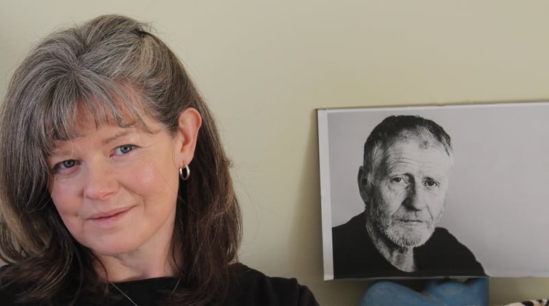 Eileen Gogan pictured with a picture of Sean O'Hagan: "My music is like The old world falling on the new."