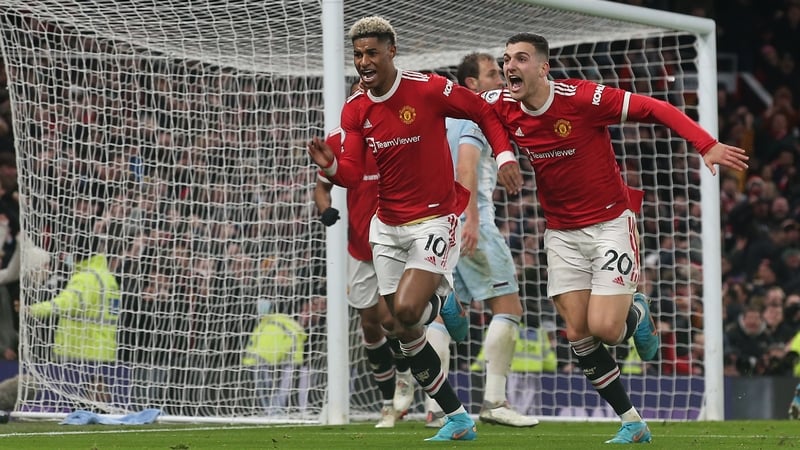 Marcus Rashford wheels away in celebration after his dramatic winner.