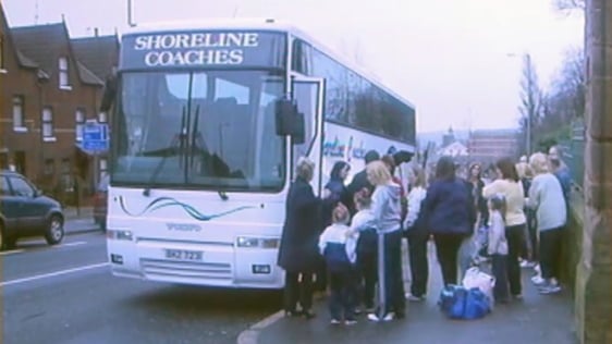 Coach outside Holy Cross Primary School in Belfast, 2002.