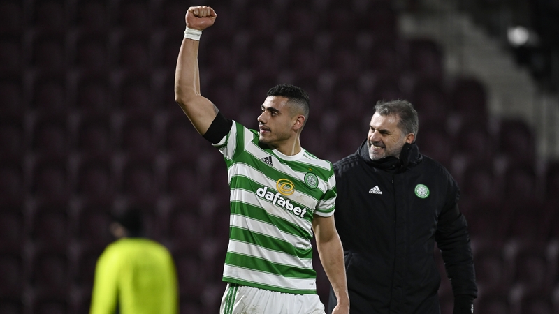Celtic's Giorgos Giakoumakis (left) with manager Ange Postecoglou at full-time