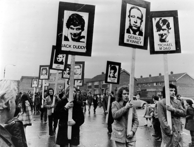 Marchers in Derry carrying signs for the deceased on the one year anniversary of Bloody Sunday