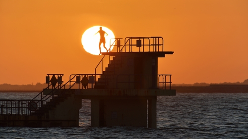 A man pictured going for an evening dip in Balckrock, Galway (Pic: Chaosheng Zhang)