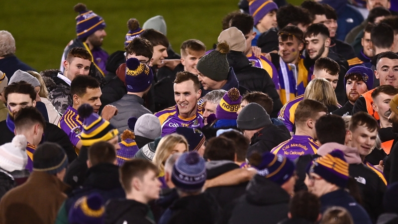 Kilmacud Crokes players celebrate with supporters after the game